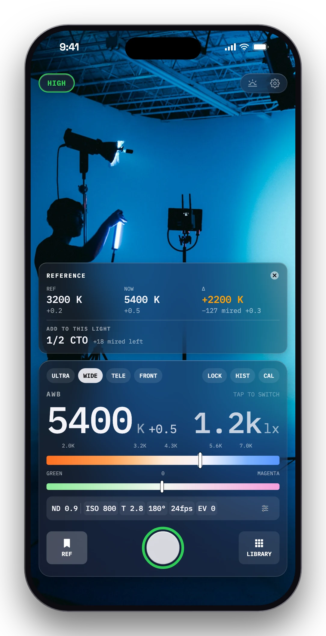 Cutvey Meter on iPhone: the REFERENCE card comparing two lights over a blue cyc studio.
